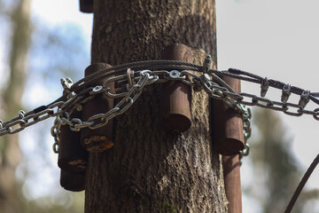Fastening in the rope park.Mechanisms for securing ropes and wooden elements.Sports amusement park for children and adults.A reliable and safe route above ground level.Route between trees