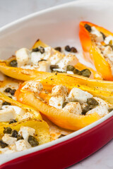 baked yellow peppers with feta cheese and capers