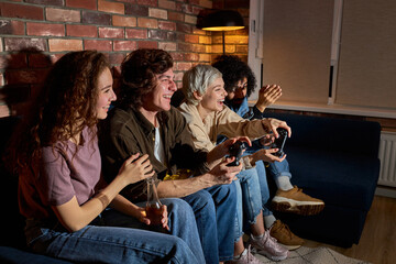 Naklejka premium Crazy Young People Friends Enjoying Playing Videogame Game Console, Resting At Home, Resting At Home, In Casual Clothes, Games Console