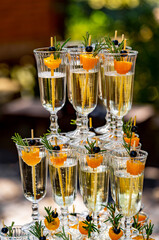 Tower glasses of champagne. Luxury piyramid with champagne.