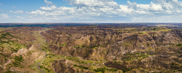 Aerial view of road into Makoshika State Park in Montana - Badlands