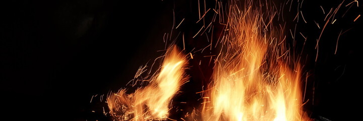 Flames Of Fire And Sparks Isolated On Black Background. Abstract Flaming Background. Magic Fiery...