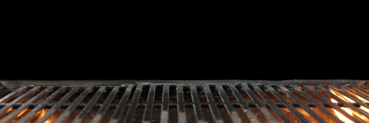 Barbecue Fire Grill Isolated On Black Background. BBQ Flaming Charcoal Grill Isolated. Hot Barbeque Charcoal Cast Iron Grill With Bright Flames Of Fire. Abstract Panoramic Grill Wide Banner. - obrazy, fototapety, plakaty