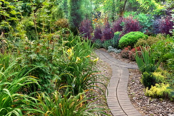 Backyard Garden Modern Design Landscaping. Decorative Garden Winding Pathway Walkway From Black...