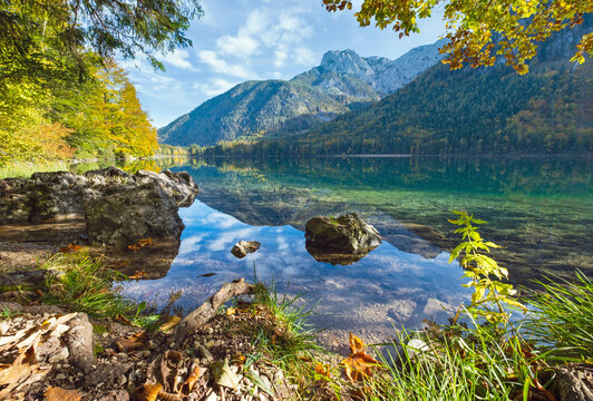 Peaceful autumn Alps mountain lake with clear transparent water and reflections. Langbathseen lake, Upper Austria.