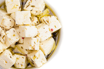 Bowl Filled with Cubed Feta Cheese on a White Background