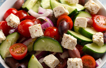 Bowl of Fresh Greek Salad with Cucumbers Tomatoes Olives and Feta Cheese