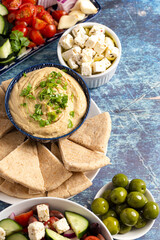Fresh Greek Food on a Rustic Wooden Background