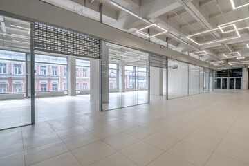 Fototapeta premium Modern white empty room interior with columns and panoramic windows. room for office or store