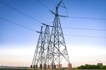 High voltage power line on industrial electricity line tower for electrification rural countryside....