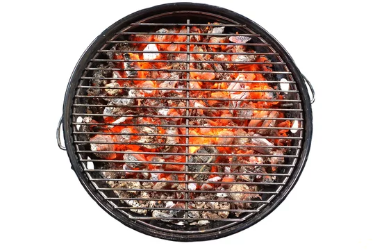 Kettle Grill Pit With Flaming Charcoal. Top View Of BBQ Hot Kettle Grill With Stainless Steel Grid Isolated Background Overhead View. Barbecue Kettle Grill On Backyard Ready Grilling Cookout Food. fot...