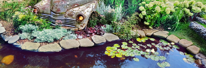 Modern Landscaped Backyard Garden with Small Artificial Pond from PVC and Old Car as Designed...