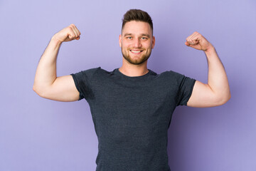 Russian handsome man over isolated background doing strong gesture