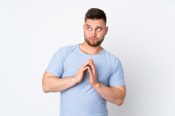 Russian handsome man over isolated background scheming something