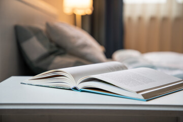 cozy bedroom detail focus on open book