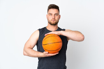 Russian handsome man isolated on white background playing basketball