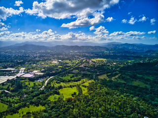 Fototapeta na wymiar View of Jarabacoa with clouds and mountains