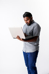 Professional man holding a laptop and thinking isolated on white background