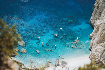 Pleasure boats anchored at Mizithres cliff rock in Zakynthos Ionian island, Greece