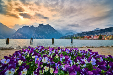 View of the beautiful Lake Garda in the springtime,Torbole city surrounded by mountains in Trentino alto Adige region,italy