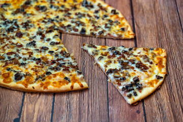 Hot pizza with ham, bechamel sauce, mushrooms, bacon and cheese.Concept poster for restaurants or pizzerias.	