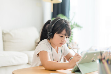 Asian girl student online learning at home.study online video call zoom teacher, kid girl learn...