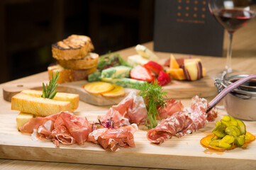A Charcuterie, or cold cut, platter, at a Whistler restaurant.  Meat, ham, port, salami, pate, cheese, and fruit.