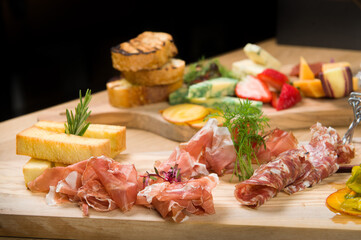 A Charcuterie, or cold cut, platter, at a Whistler restaurant.  Meat, ham, port, salami, pate, cheese, and fruit.