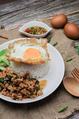 Thai Stir fried  basil with minced pork, chili and fried egg on topped rice. Thai local food style call 