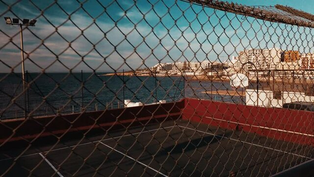 An empty basketball stadium on the coast of Bugibba, Malta. High quality 4k footage