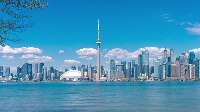 4K timelapse of daytime view of Toronto skyline and Lake Ontario during spring summer as seen from Toronto island,Toronto, Ontario Canada