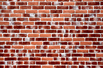 Wall texture of bright red brick with decorative white spots, straight view