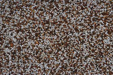 Brown and white pebblecrete wall background