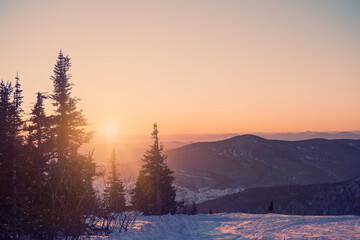 Sunset view above beautiful winter mountain landscape