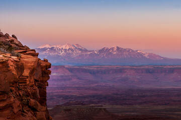 The La Sal Mountains seen in the distance from the Grand View Point Overlook in Canyonlands National Park at sunset