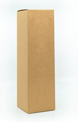 Beautiful paper box for bottle packaging, tall shape natural brown box, standing on white background, 45 degrees angle view, blank space for a branding design label. The concept for natural products