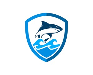 Simple shield with jumping shark in the sea