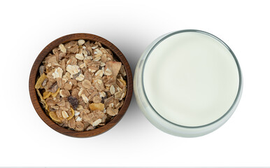 milk in transparent glass and muesli multi fruit in wooden bowl and spoon isolated on white background ,include clipping path