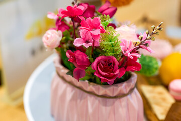 A bunch of artificial flowers, red pink roses