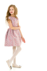 Portrait of Thoughtful Beautiful Blonde Girl Standing on One Leg