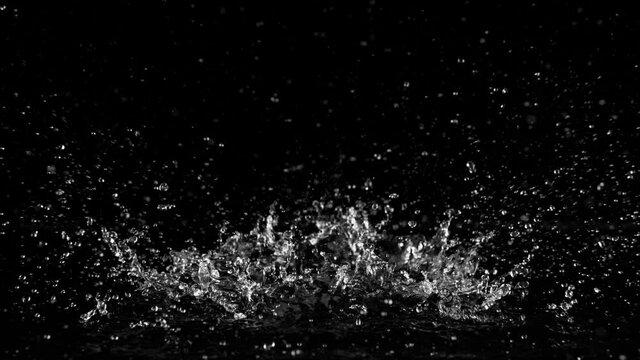Super slow motion of splashing water isolated on black background. Filmed on high speed cinema camera, 1000 fps.