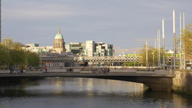 The Custom House Dome, Tara Street Railway Line And Butt Bridge Over Liffey River From Rosie Hackett Bridge In Dublin, Ireland. - wide shot