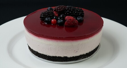 Raspberry cheesecake on white plate
