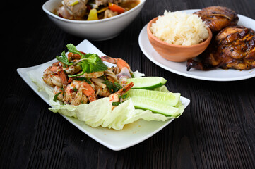 Thai food - spicy Shrimp salad with garlic and basil