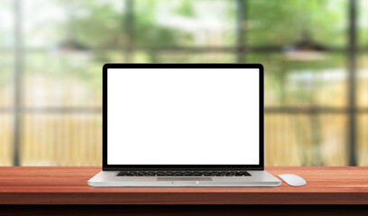 Laptop or notebook with blank screen on wood table in blurry background with house or office modern ,nature orange bokeh and sunlight in morning.effect light of manual lens