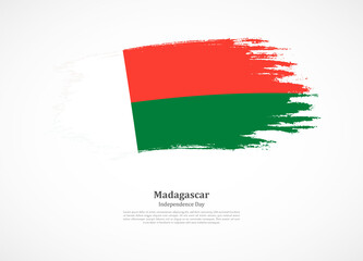Happy independence day of Madagascar with national flag on grunge texture