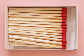 Matchbox with wooden matches, team or neighbors concept, top view, flat lay
