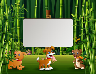 Three of dogs cartoon with a blank sign in the forest