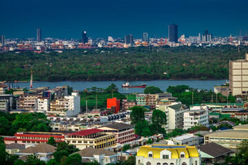 The high angle background of the city view with the secret light of the evening, blurring of night lights, showing the distribution of condominiums, dense homes in the capital community