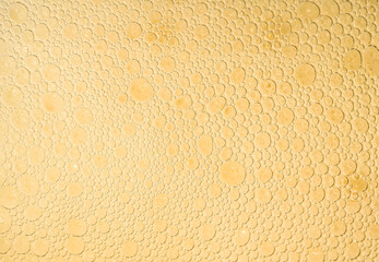 beer foam texture close up , porous ale bubble background macro , colored bar lager backdrop